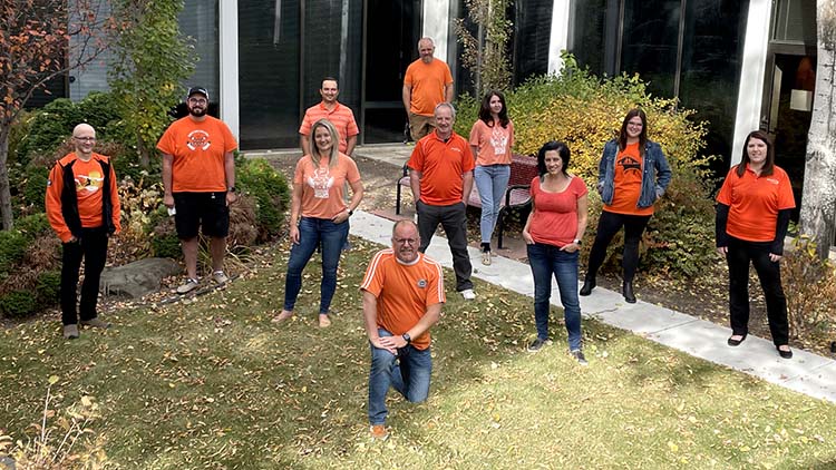 Pasonites who work in the office for operational effectiveness gathered for a physically-distanced photo with their orange shirts on Sept. 30.